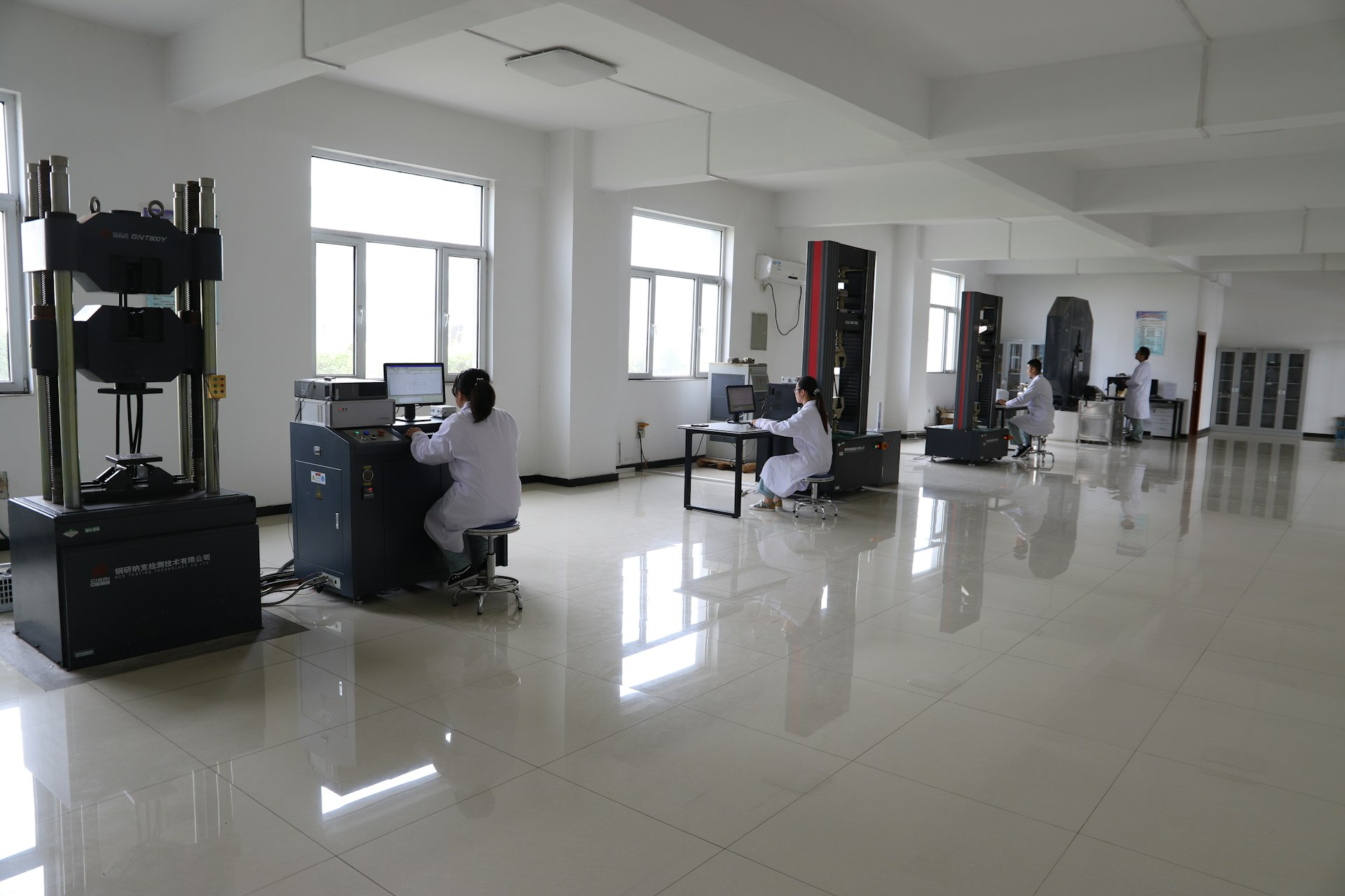 Workers in a laboratory with testing equipment